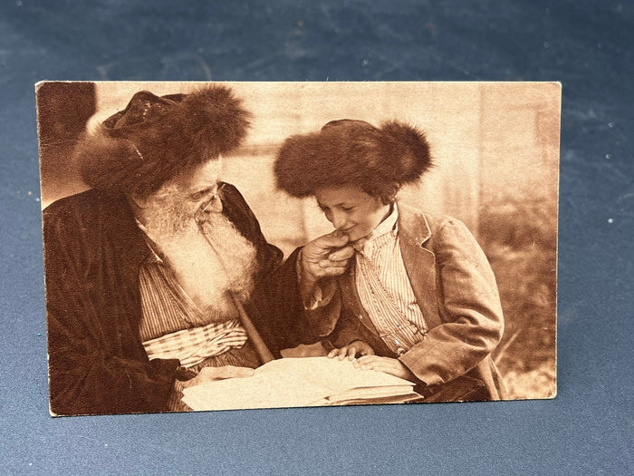 Rabbi examining his grandsons bible